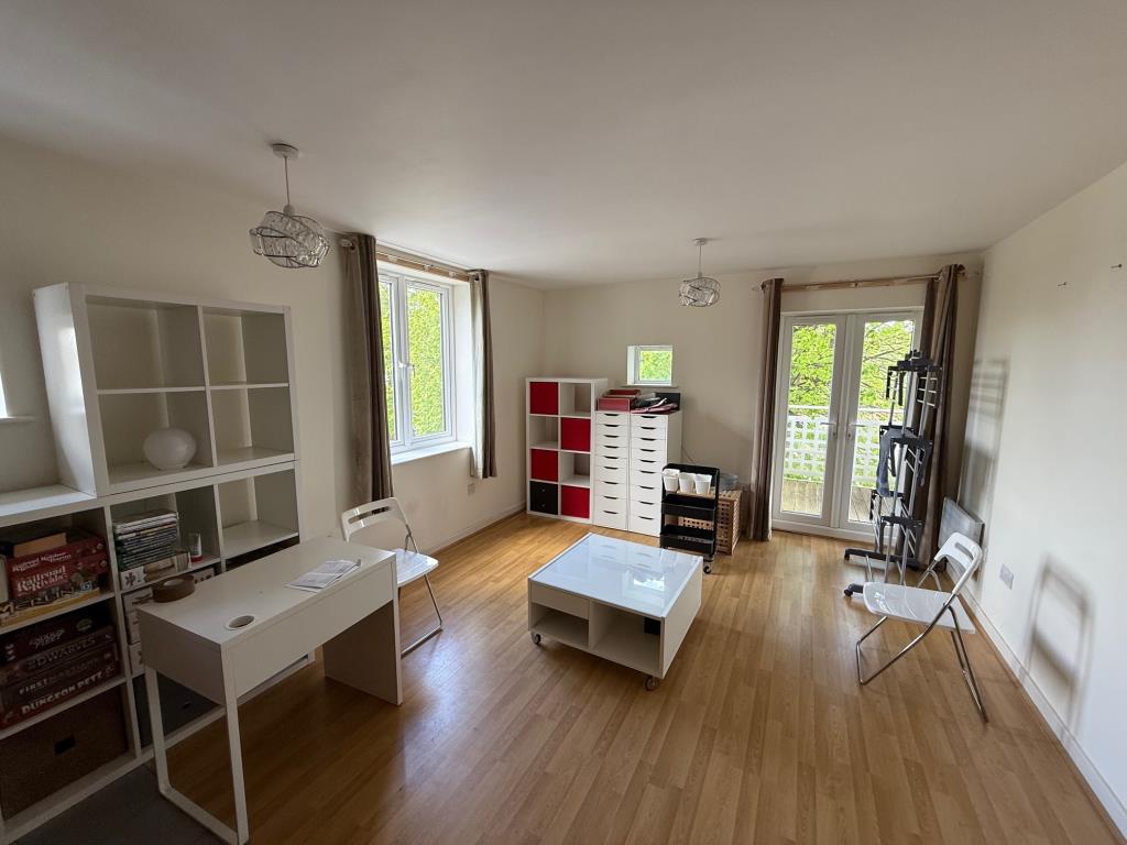 Lot: 58 - FLAT FOR INVESTMENT - Living room with doors to balcony